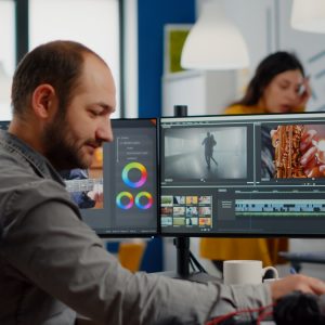 Video maker editing movie using post production software